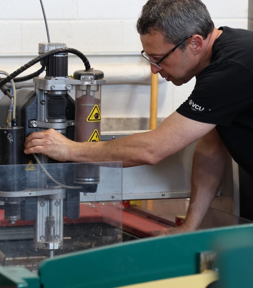 Professor inspecting tools in classroom