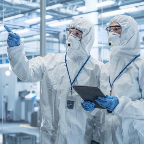 photo of two people in a cleanroom