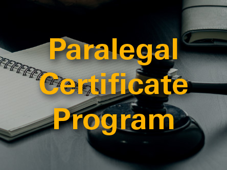 Picture of someone signing a document with the words paralegal certificate program superimposed over top of it