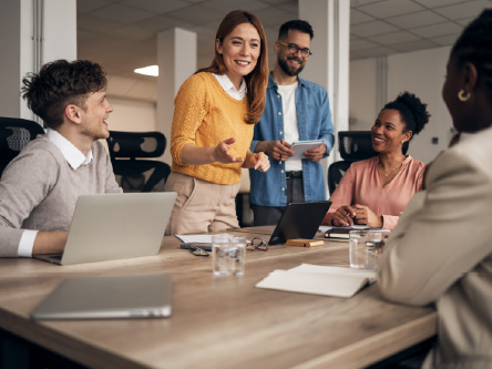 A group of people talking on the table