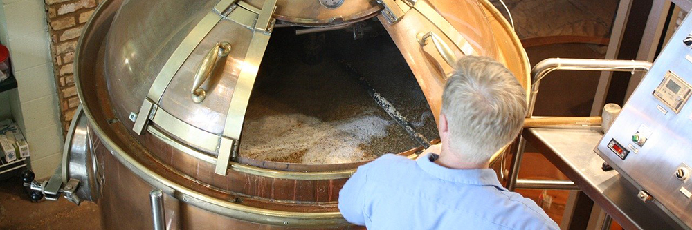 Image of a worker brewing beer