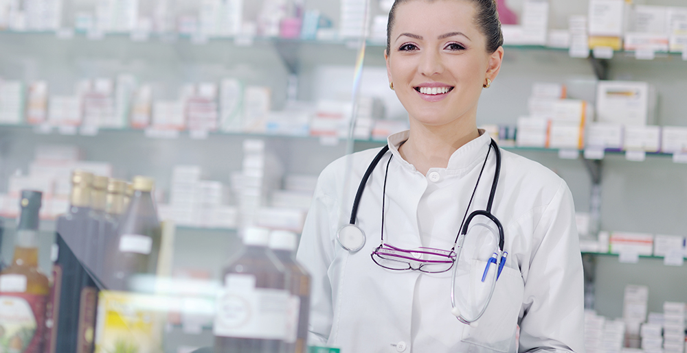 A woman standing in a pharmacy.